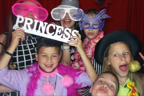 Boys and girls at a Photobooth and Disco Birthday Party hosted by Bop till you Drop